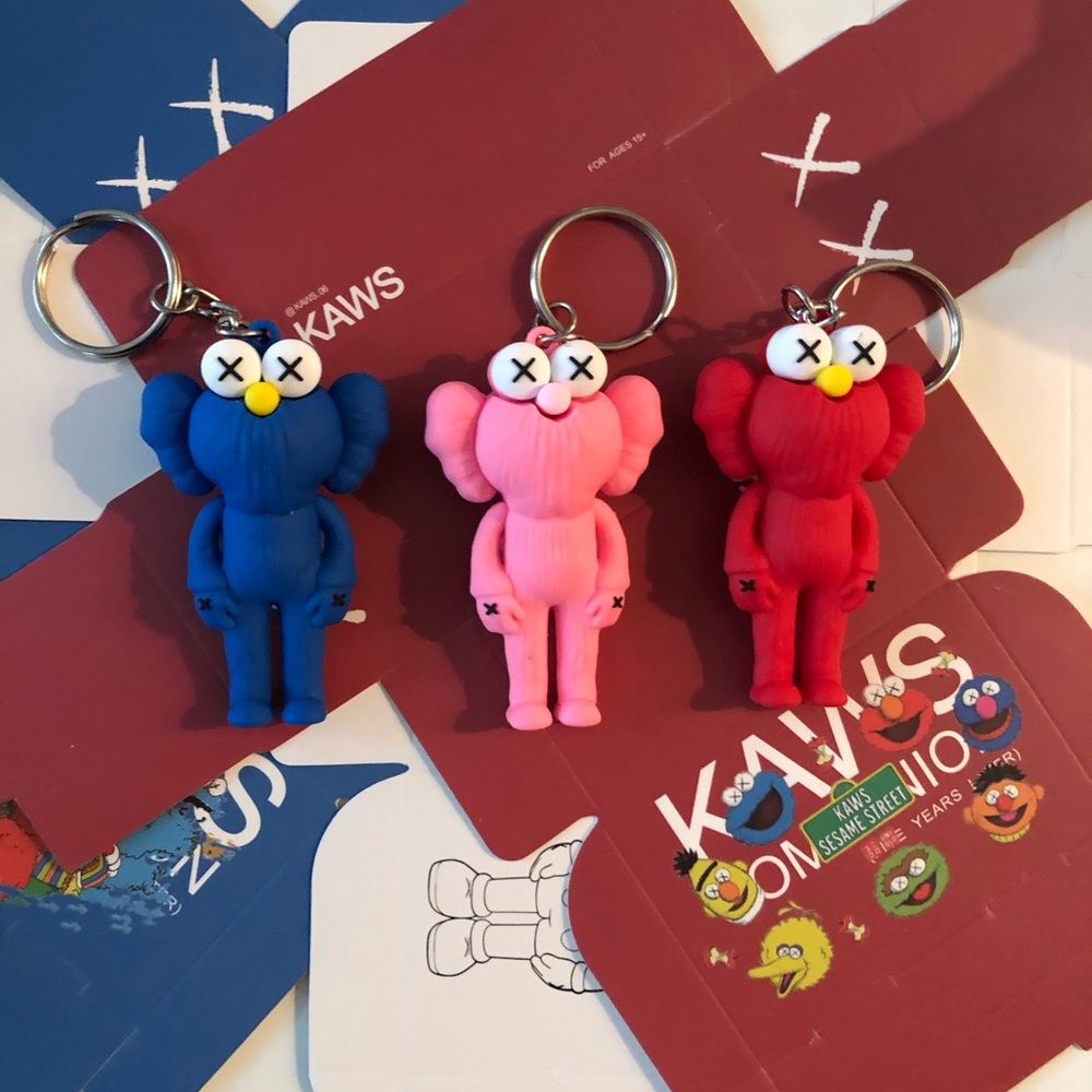 Rainbow of 3 kaws with boxes